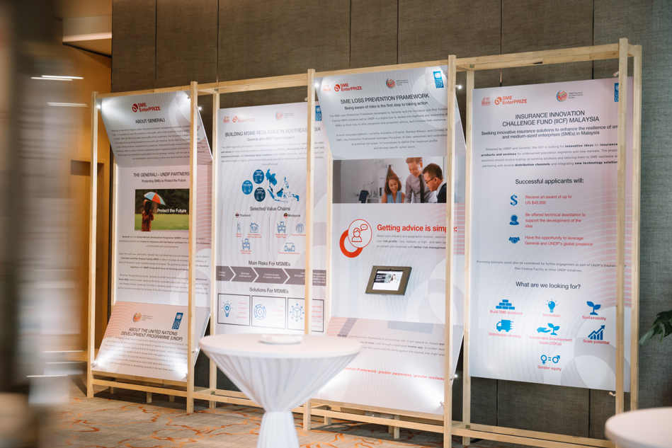 Display boards describing the Generali–UNDP partnership, SME Loss Prevention Framework and Insurance Innovation Challenge Fund Malaysia.